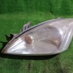 Фара левая Mitsubishi Lancer 