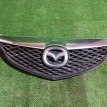 Решетка радиатора Mazda 2 оригинальный номер GJ6A50712