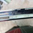 Молдинг фары противотуманной левой Мазда Сх 9 mazd Mazda 2 оригинальный номер TD1250C22A