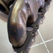 Коллектор выпускной левый Porsche Cayenne 1 Porsche Cayenne оригинальный номер 1049721114