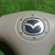 Подушка безопасности в рулевое колесо Mazda 2 оригинальный номер B28V57K00