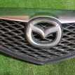 Решетка радиатора Mazda 2 оригинальный номер GJ6A50712