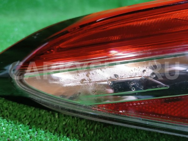 Фонарь задний наружный левый Toyota Camry оригинальный номер 8156033690