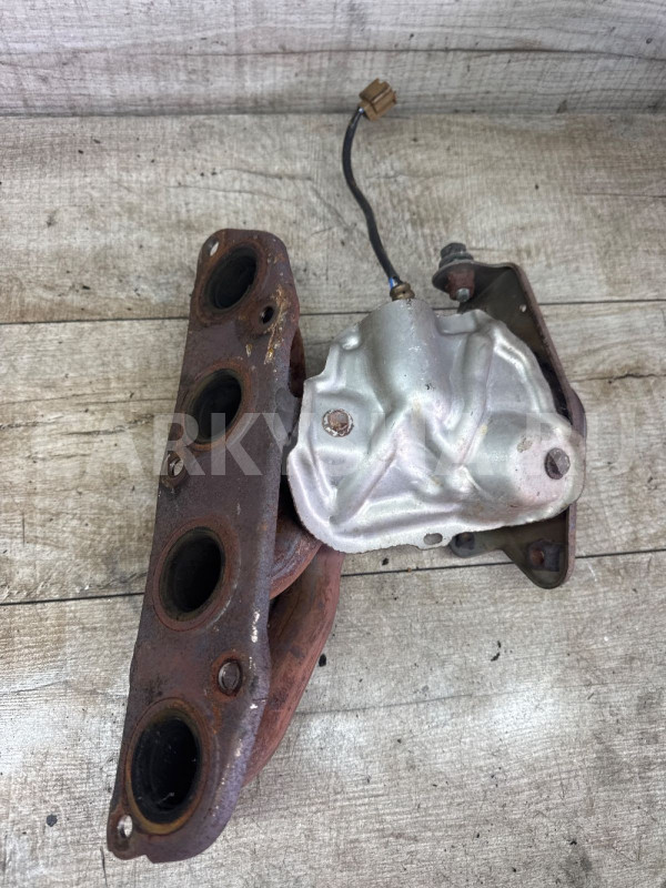 Коллектор выпускной 14002EE00A HR16DE 1.6L Nissan Nissan Tiida оригинальный номер 14002EE00A