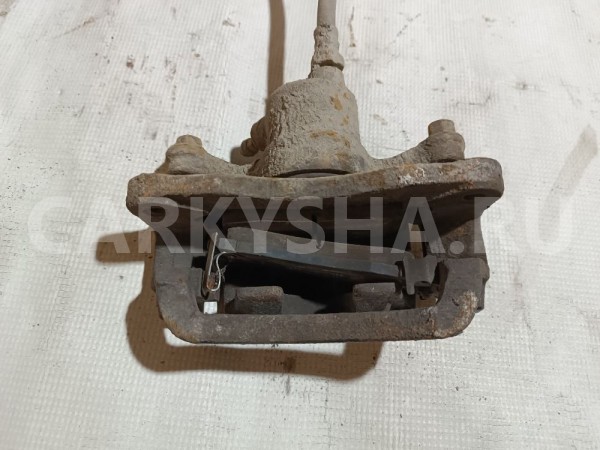 Суппорт тормозной задний левый Mitsubishi Diamante 