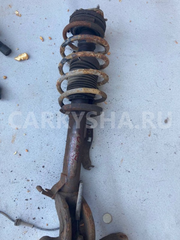 Амортизатор передний левый Mazda Demio IDY (2002—2007) Mazda 2 оригинальный номер DY3