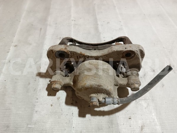 Суппорт тормозной передний левый Mitsubishi Galant 