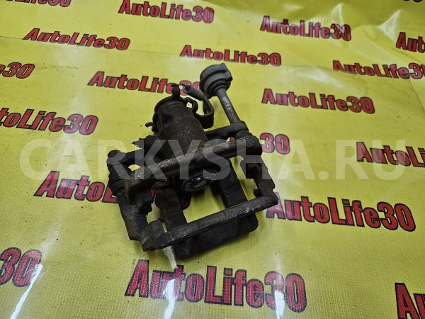 Суппорт тормозной задний левый Opel Astra 
