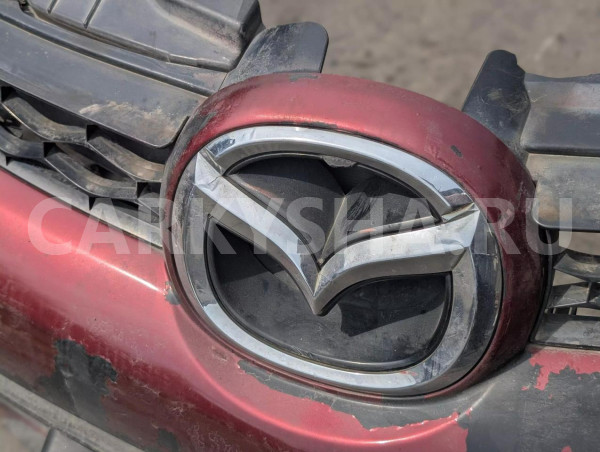 Бампер Mazda CX-7 оригинальный номер EH45-501T1