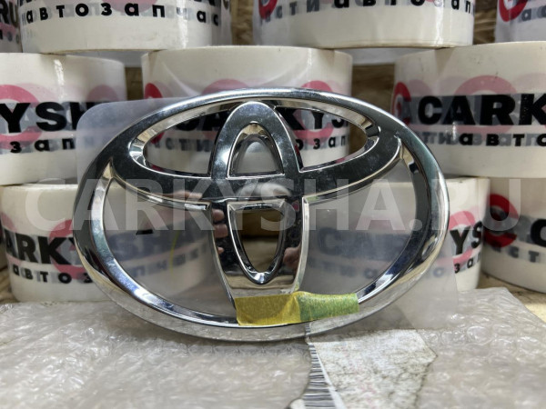 Эмблема крышки багажника Toyota Camry VI (XV40) оригинальный номер 90975-02064