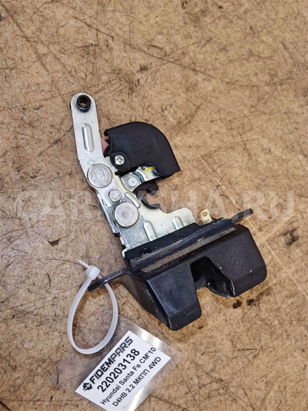 Название детали Замок багажника Модель Hyundai Santa Fe CM Hyundai Santa Fe оригинальный номер 812302B000
