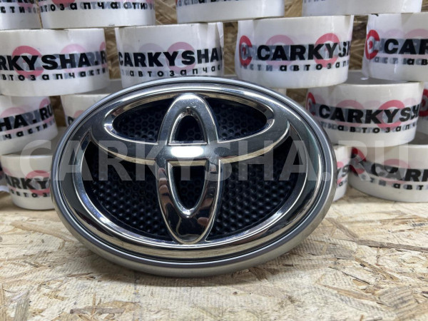 Эмблема решетки радиатора Toyota Land Cruiser Prado 150 Series Рестайлинг оригинальный номер 90975-02091