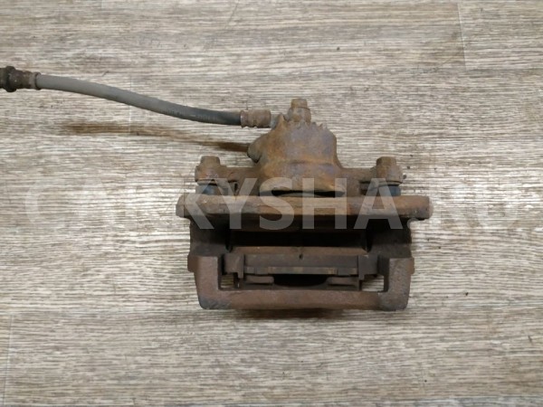 Суппорт тормозной задний левый Kia Sorento 