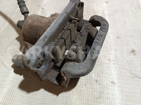 Суппорт тормозной задний левый Suzuki Grand Vitara 