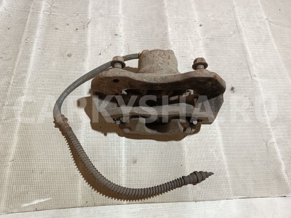 Суппорт тормозной передний левый Mitsubishi Lancer 