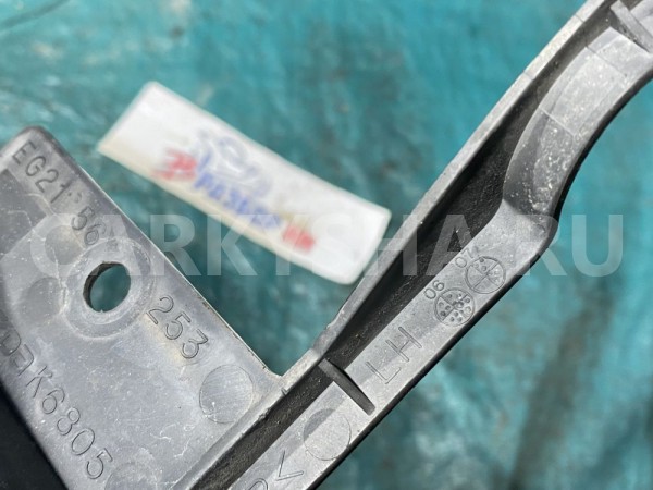 Дефлектор радиатора левый Mazda CX-7 I (2006—2009) Mazda 2 оригинальный номер EG2156253