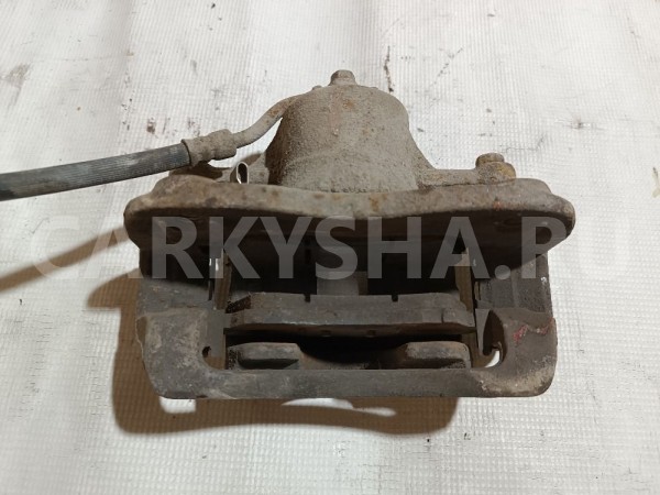 Суппорт тормозной передний левый Kia Rio 