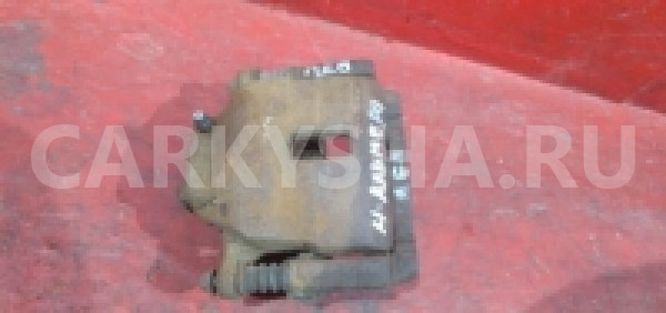 Суппорт передний левый Nissan Almera (N16)  Nissan Almera 
