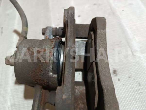 Суппорт тормозной передний левый Suzuki Grand Vitara 