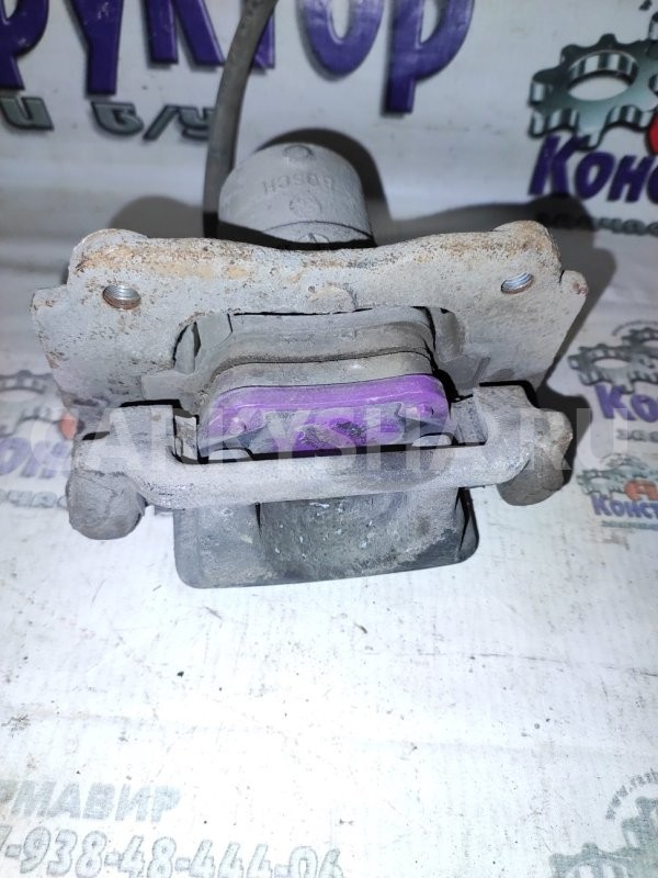 Суппорт тормозной Toyota Avensis 