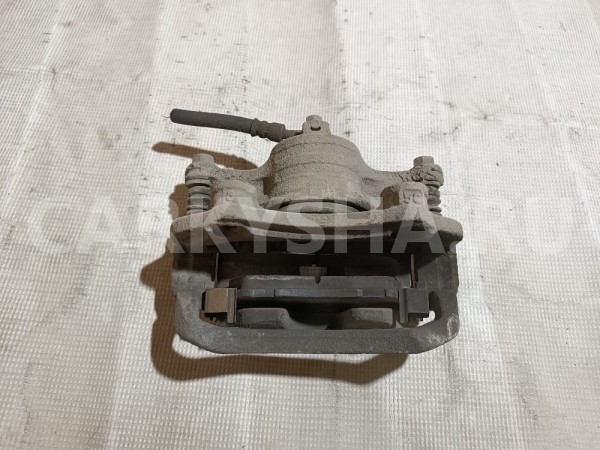 Суппорт тормозной передний левый Nissan Bluebird Sylphy 