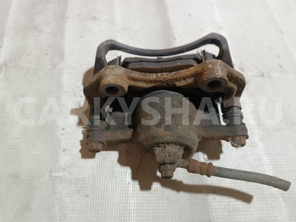 Суппорт тормозной передний левый Nissan Almera Classic 