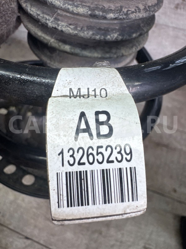 Амортизатор левый (стойка) передняя Cruze Astra j Chevrolet Cruze оригинальный номер 13402938