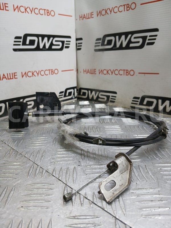 Трос замка багажника Nissan Primera 