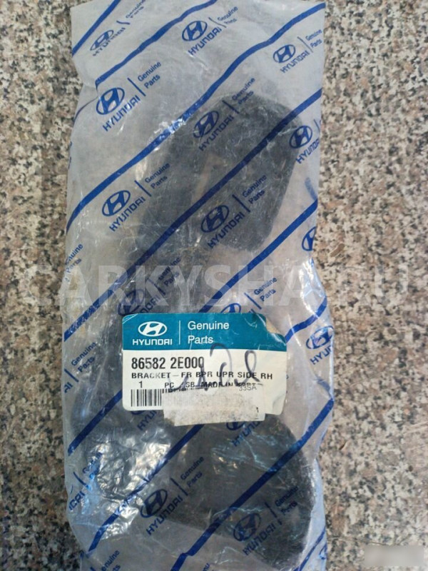 Кронштейн фар правый Хундай Туксан tucson (2004) Hyundai Tucson оригинальный номер 86582-2E000