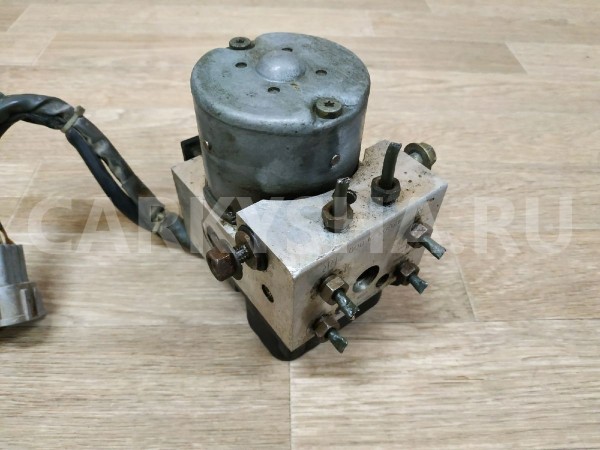 Блок ABS (насос) Nissan Primera оригинальный номер 476002F000