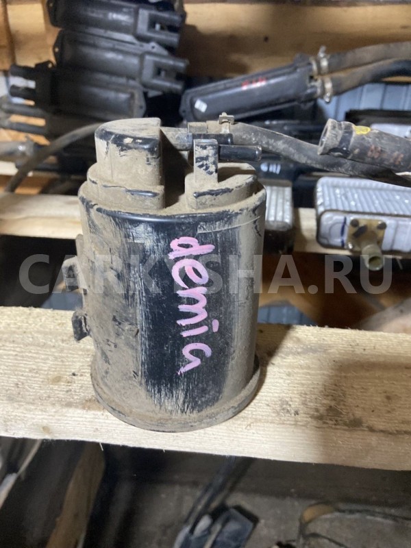 Абсорбер (фильтр угольный) Mazda Demio DW (1996—2003) Mazda 2 оригинальный номер Mazda FPD513970A