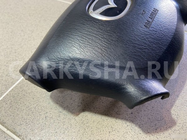 Подушка безопасности водителя Mazda Familia 2001 г Mazda 2 оригинальный номер B25F57K00