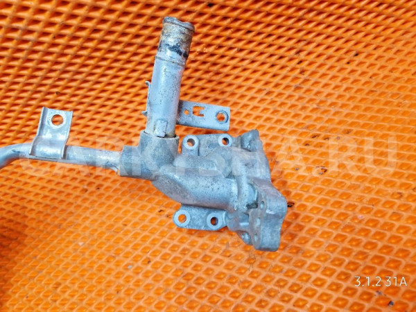 Корпус помпы трубка Suzuki Jimny Alto K6A 0.7 Suzuki Jimny 