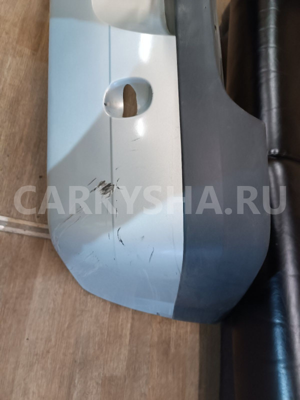 Бампер задний Renault 20 оригинальный номер 6001546776